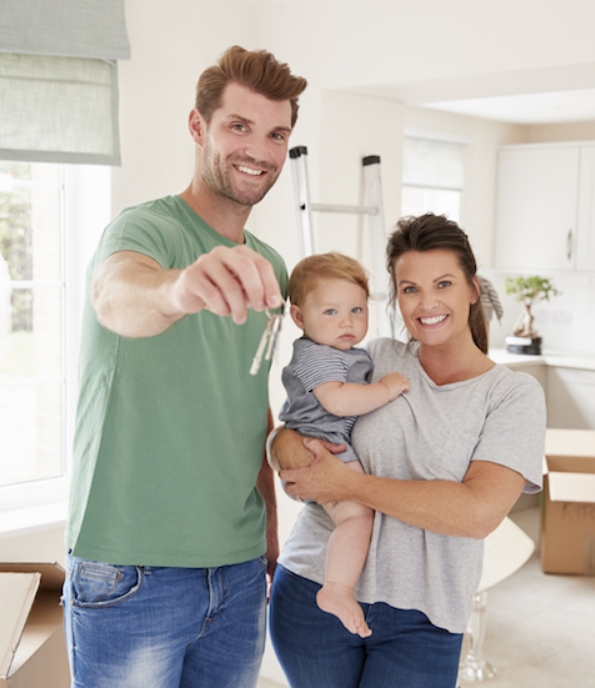 couple with child holding keys